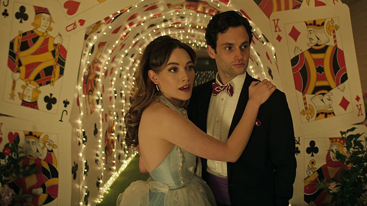 Penn Badgley and Victoria Pedretti in We're All Mad Here (2021)