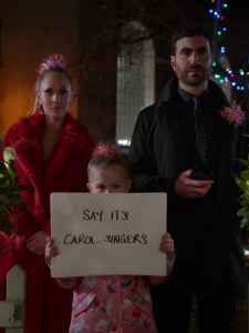 Juno Temple, Elodie Blomfield, and Brett Goldstein as Keeley, Phoebe, and Roy in Ted Lasso Carol of the Bells