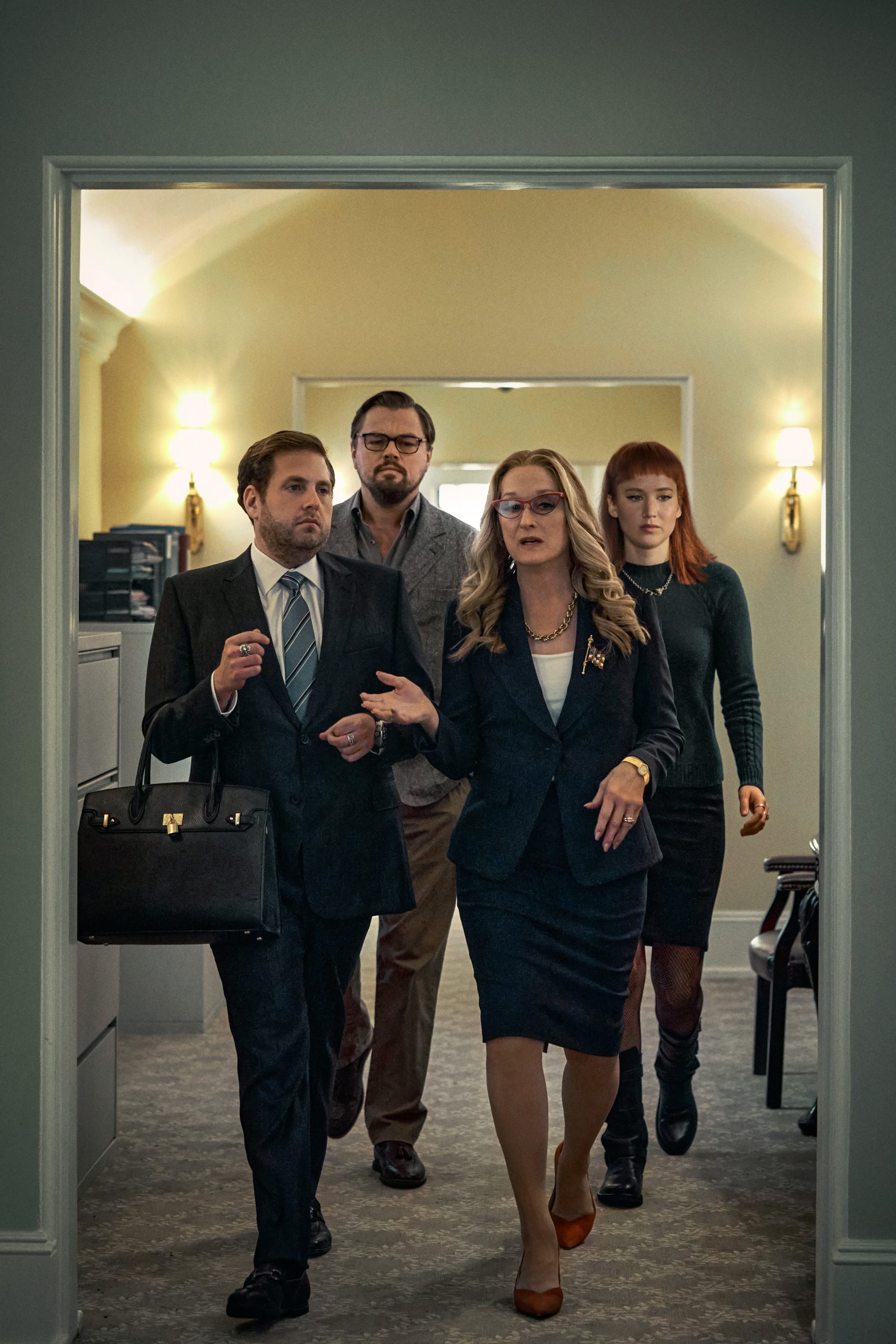 DON'T LOOK UP (L to R) JONAH HILL as JASON ORLEAN, LEONARDO DICAPRIO as DR. RANDALL MINDY, MERYL STREEP as PRESIDENT JANIE ORLEAN, JENNIFER LAWRENCE as KATE DIBIASKY. Cr. NIKO TAVERNISE/NETFLIX © 2021
