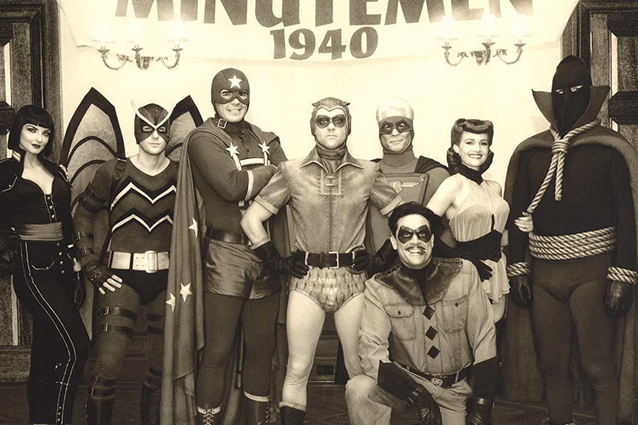 Carla Gugino, Jeffrey Dean Morgan, Darryl Scheelar, Dan Payne, Glenn Ennis, Apollonia Vanova, Clint Carleton, and Niall Matter in Watchmen (2009)
