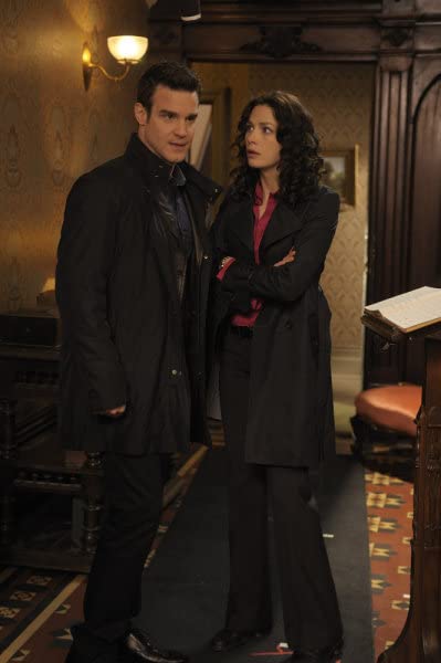 Eddie McClintock and Joanne Kelly in Warehouse 13 (2009)