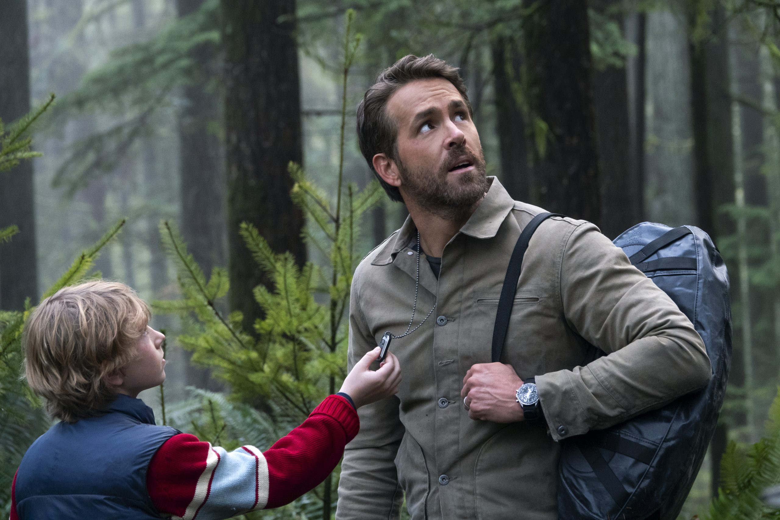 THE ADAM PROJECT - (L to R) Walker Scobell as Young Adam and Ryan Reynolds as Big Adam. Cr. Doane Gregory/Netflix © 2022