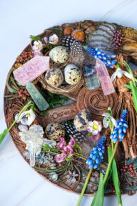 Altar for spring Ostara sabbath. wiccan wheel of the year with flowers, crystals, eggs. Esoteric Ritual for Ostara, pagan holiday, Magical Spring equinox